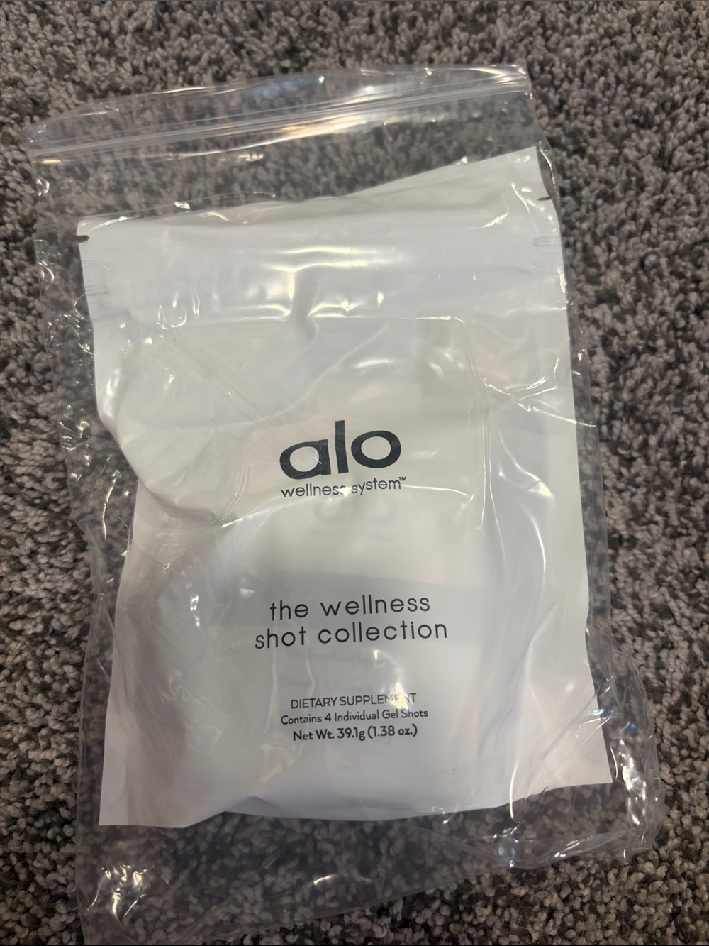 ALO Yoga wellness shots with White, Green, Orange, Purple, Yellow Accents